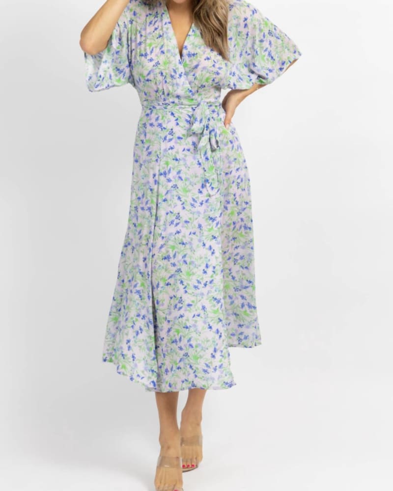 Front of a model wearing a size L Floral Wrapped Midi Dress In Lavender + Blue in Lavender + Blue by OLIVACEOUS. | dia_product_style_image_id:353621
